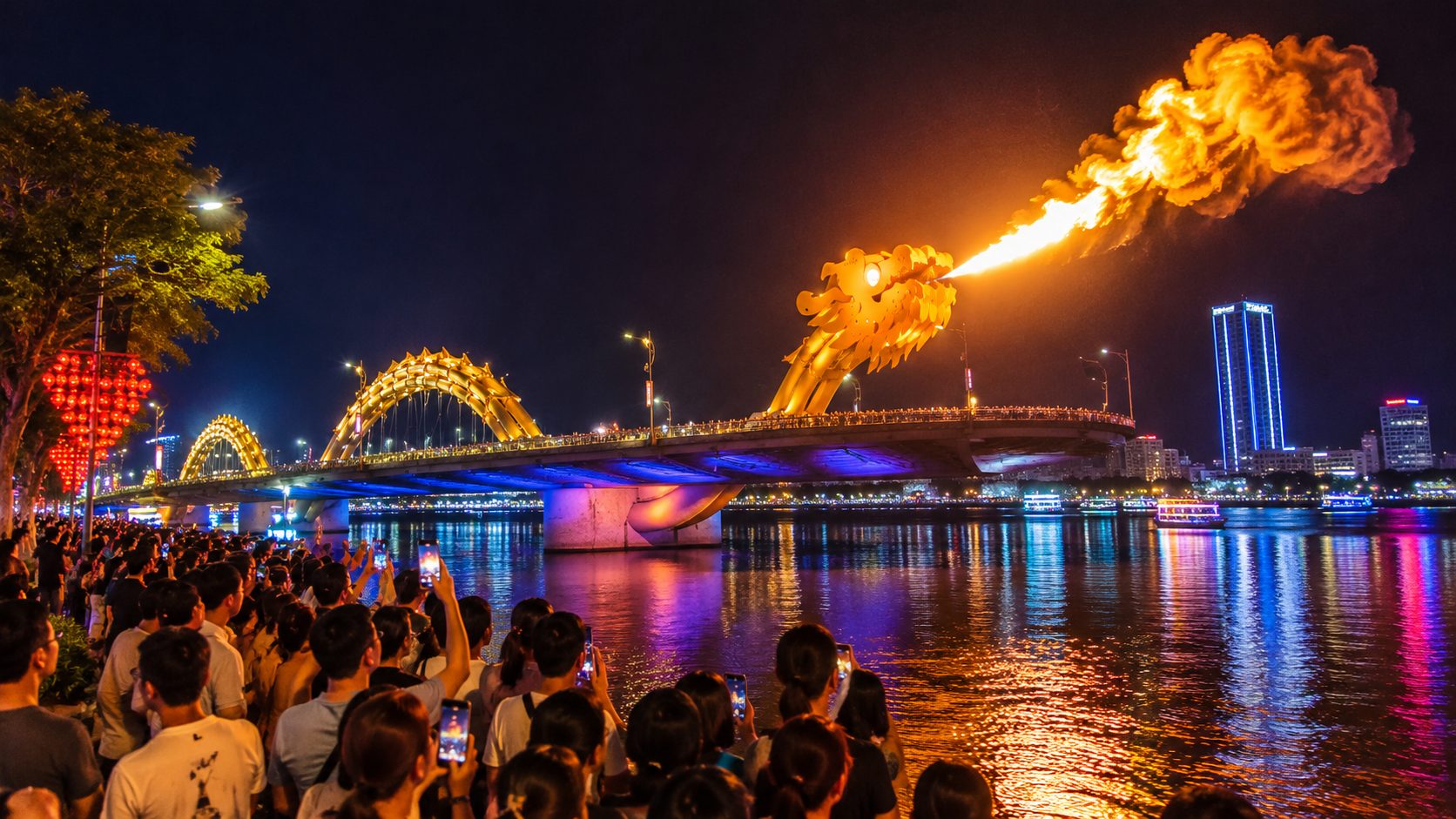 Night view of Da Nang's Dragon Bridge breathing fire, viewed from the open-top deck of a hop on hop off