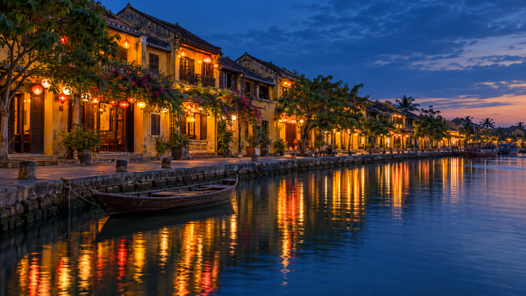 Lantern reflections along Hoi An’s historic riverside at blue hour